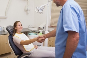 a woman in the dental chair at her consultation