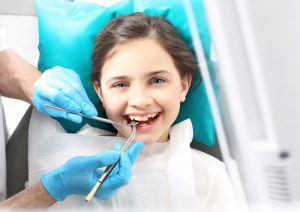 little girl at the dentist's office