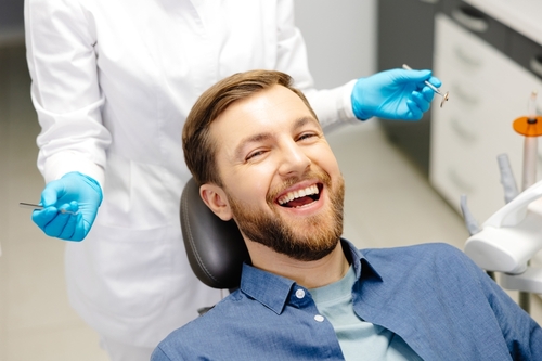man smiling in dental chair