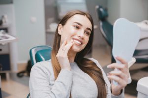 woman looking at her smile